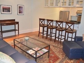 Living room features a 42 inch TV over the fireplace