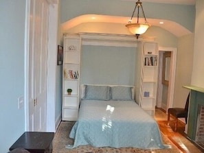 Queen-sized bed in spacious bedroom