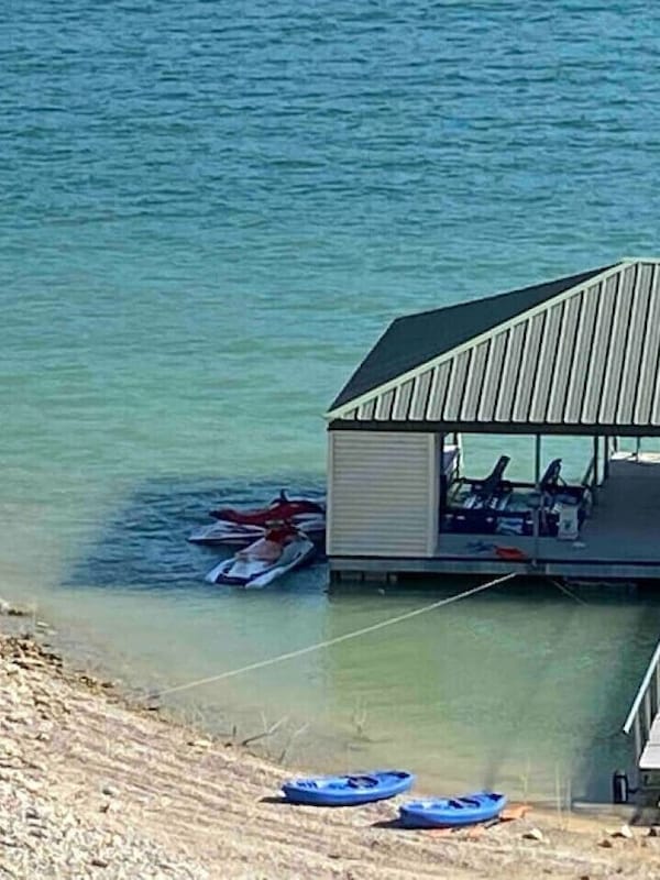Dock has two boat slips, two jet ski lifts and a boat whip for extra boat. Deep water access year round and includes boat rental