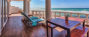 Your two, multi-level terraces sit high above the beach for added privacy. 