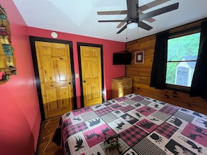 There is a King bed in the Red Room. Lay in bed and look out at the ravine.