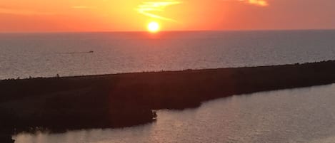 Photo Taken from Condo Balcony in May of the sunset.