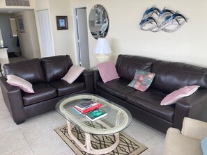 NEW leather sofa and loveseat in the living area.