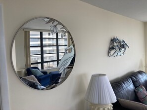 Art glass mirror in living area.