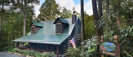 Beautiful log cabin nestled in the woods with its own brook!