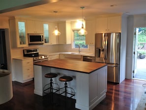 Adjoining Kitchen which any cook will love! Quartz and butcherblock countertops 