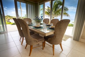 The dining table has double-fronted views of the whole beautiful bay.