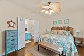Master bedroom with King size bed, attached full bathroom and Roku TV.