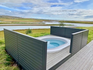 Rejuvenate and unwind in the hot tub in the midst of the beautiful countryside.