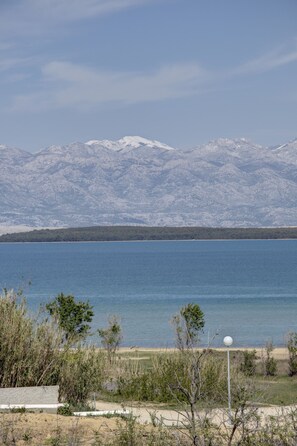 View: Queen’s Beach and Velebit Mountain.