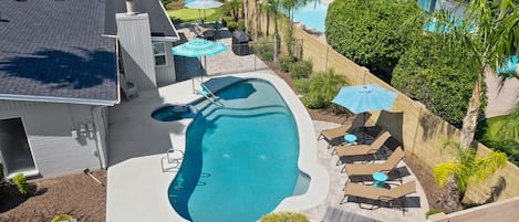 Turquoise House South Back Yard With Pool, Patio, Putting Green