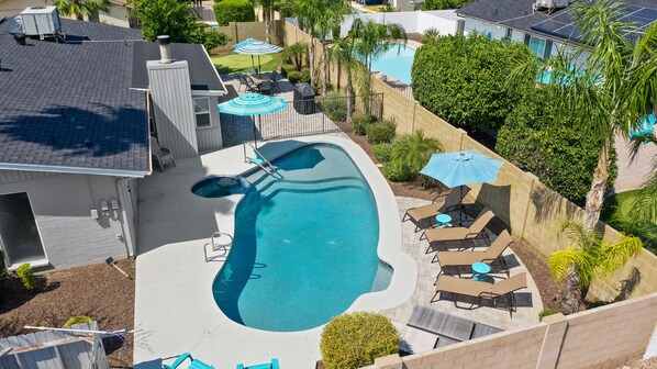 Turquoise House South Back Yard With Pool, Patio, Putting Green