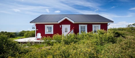 The beautiful red house up on the hill