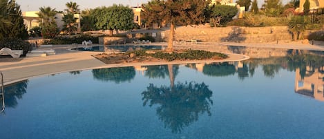 Sunset over one of the pools