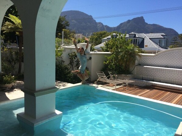 The pool and deck  with lovely Mountain view and indicating high
security. 