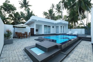 View of the pool with two bed rooms