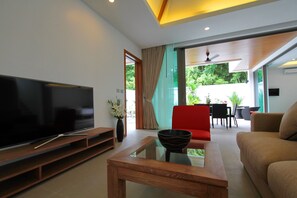 55 inch smart TV and sofa area