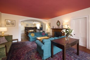 Looking from the living room under one of the arches to the kitchen