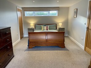 Ground floor bedroom with king sized bed, luxury mattress and plenty of storage.