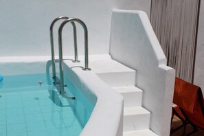 Steps to the onsite communal pool located in the secluded courtyard