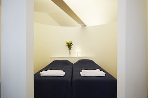 Second bedroom with two singles beds. Can be transformed in a queen size bed.