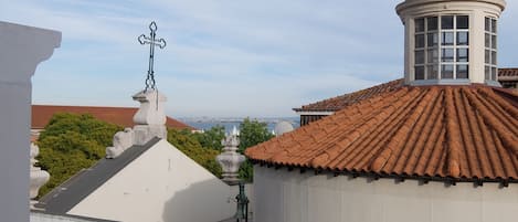 View from apartment, tower of Corpo Santo Church and Tagus River in background.