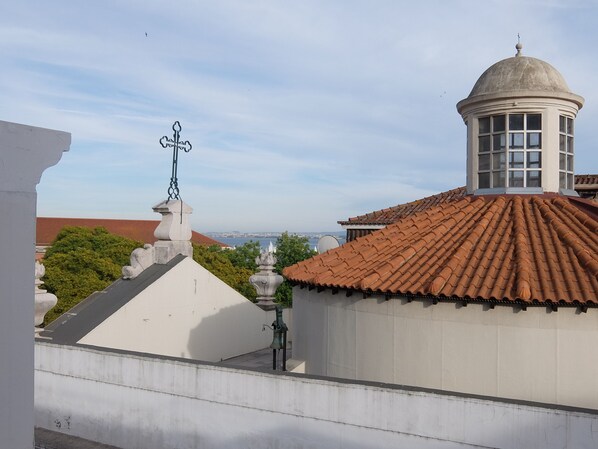 View from apartment, tower of Corpo Santo Church and Tagus River in background.