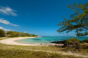 Bordering the crystal clear lagoon protected by the coral reef