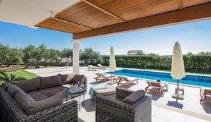 Large terrace and lounge area by the pool