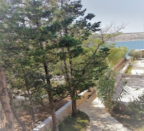 Apartments Vrtlici A1 - view from terace on 20m house path and sand beach