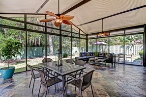 Sunroom is made of pocketing glass doors which stack and open to the outdoors.