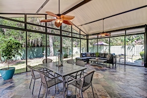 Sunroom is made of pocketing glass doors which stack and open to the outdoors.