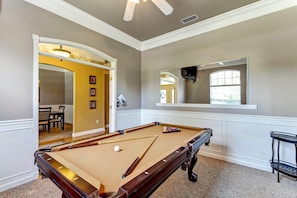 Pool room with TV.