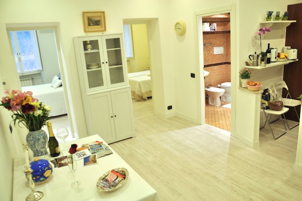 The living and dining area with a view of the two double bedrooms and bath 
