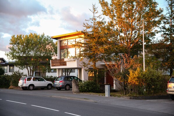 Front view of Cozy 60's villa. Free parking. Large living room windows.