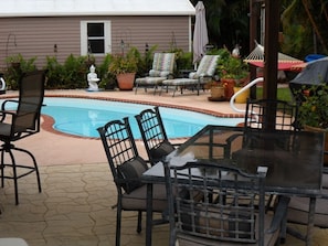 Dine outside, overlook the pool. Play an outdoor yard game, or just relax.