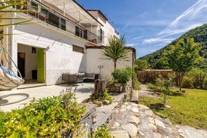 Patio with two large planters with Rosemary, Sage, Thyme and Bay leaf