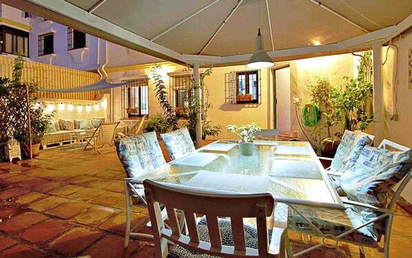 Huge 100sqm patio with dining area and chill out space. 