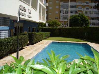 Nice Apartment with Pool , Balcony, Air Con 15 minutes from beach great location