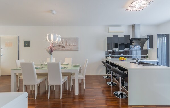 Spacious sunny dining room with 2 air conditioners.