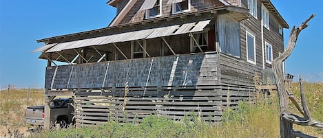 Southwest Elevation showing vacant land to the North creating amazing views.