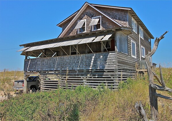 Southwest Elevation showing vacant land to the North creating amazing views.