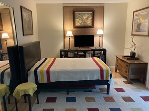 The middle bedroom with full bed, tv, and open directly to the back bedroom.  