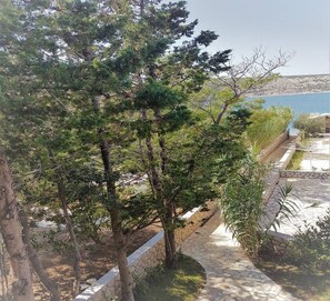 Apartments Vrtlici A2 - view from terace on pvt path to apartment sand beach 