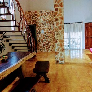 Large wood dinner table, view to the entrance and bathroom