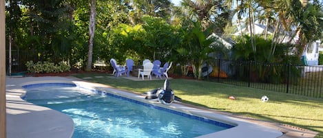 Pool, fire pit, palm trees looking west across street to beach, Gulf + trolley