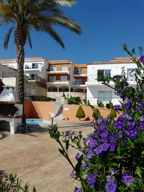 View of the apartments - ours is on the top level just to right of palm tree. 