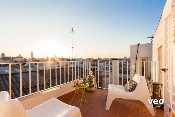 Sun-filled, private terrace with garden furniture and views.
