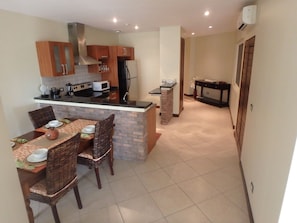 Kitchen and Dining Areas with pantry closet & enclosed laundry suite