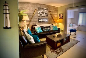 Spacious living room and sunroom can be divided with privacy curtains. 